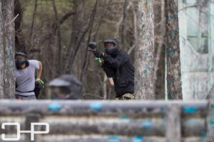 man pointing paintball gun