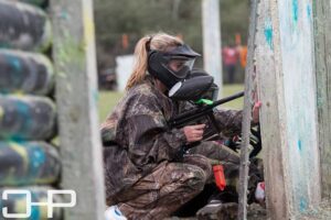 group crouching and hiding during paintball game