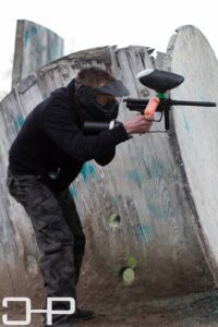 boy getting ready to shoot paintball